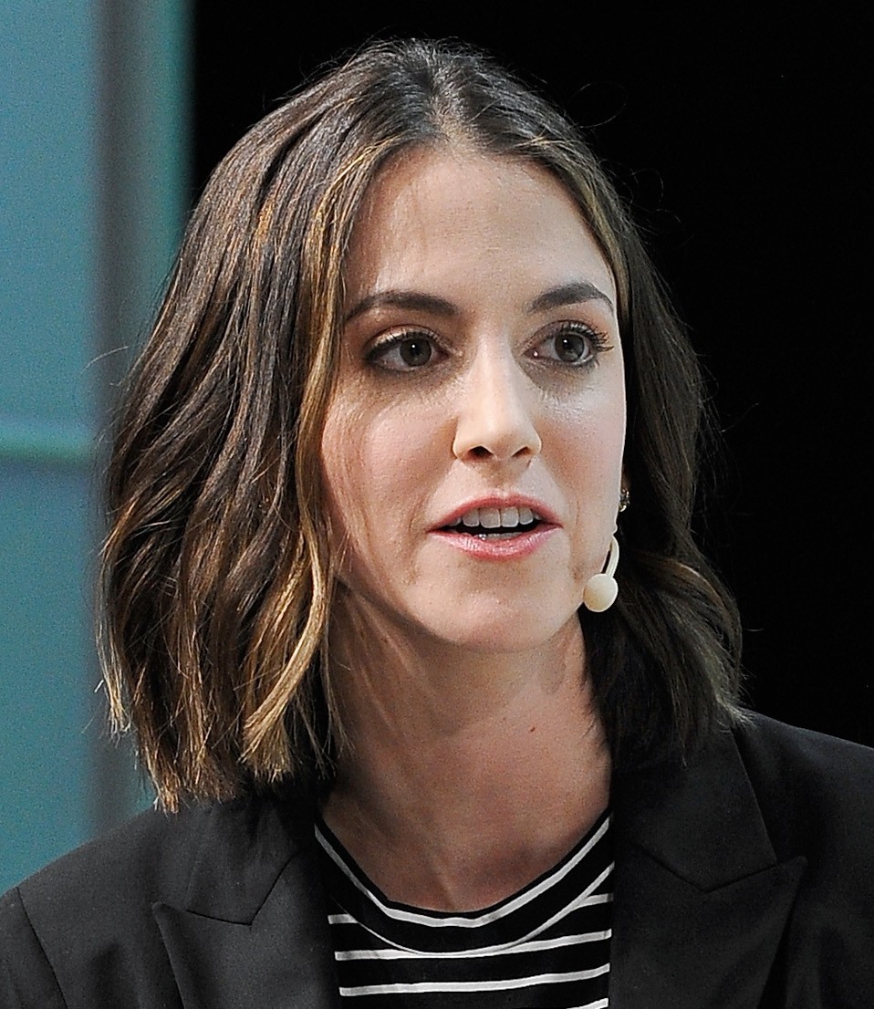 Brynn Putnam, founder and CEO of Board, speaking on stage with a headset microphone at TechCrunch Disrupt San Francisco 2018